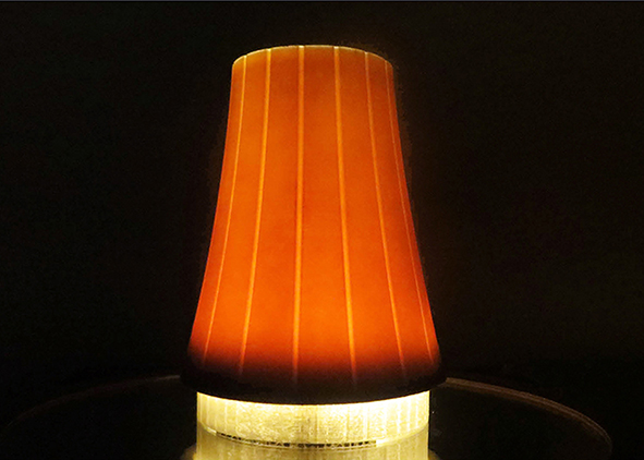 Experimentation with a composite lamp obtained with a silicone mould, with backlit (credit: F. Valente, 2018). agathón